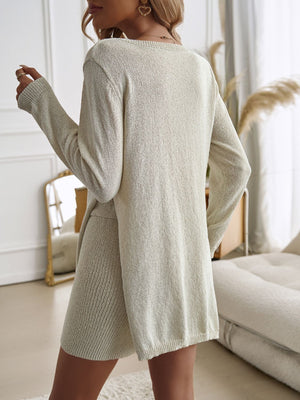 Beige textured knit co-ord set with side slit skirt and long sleeves.