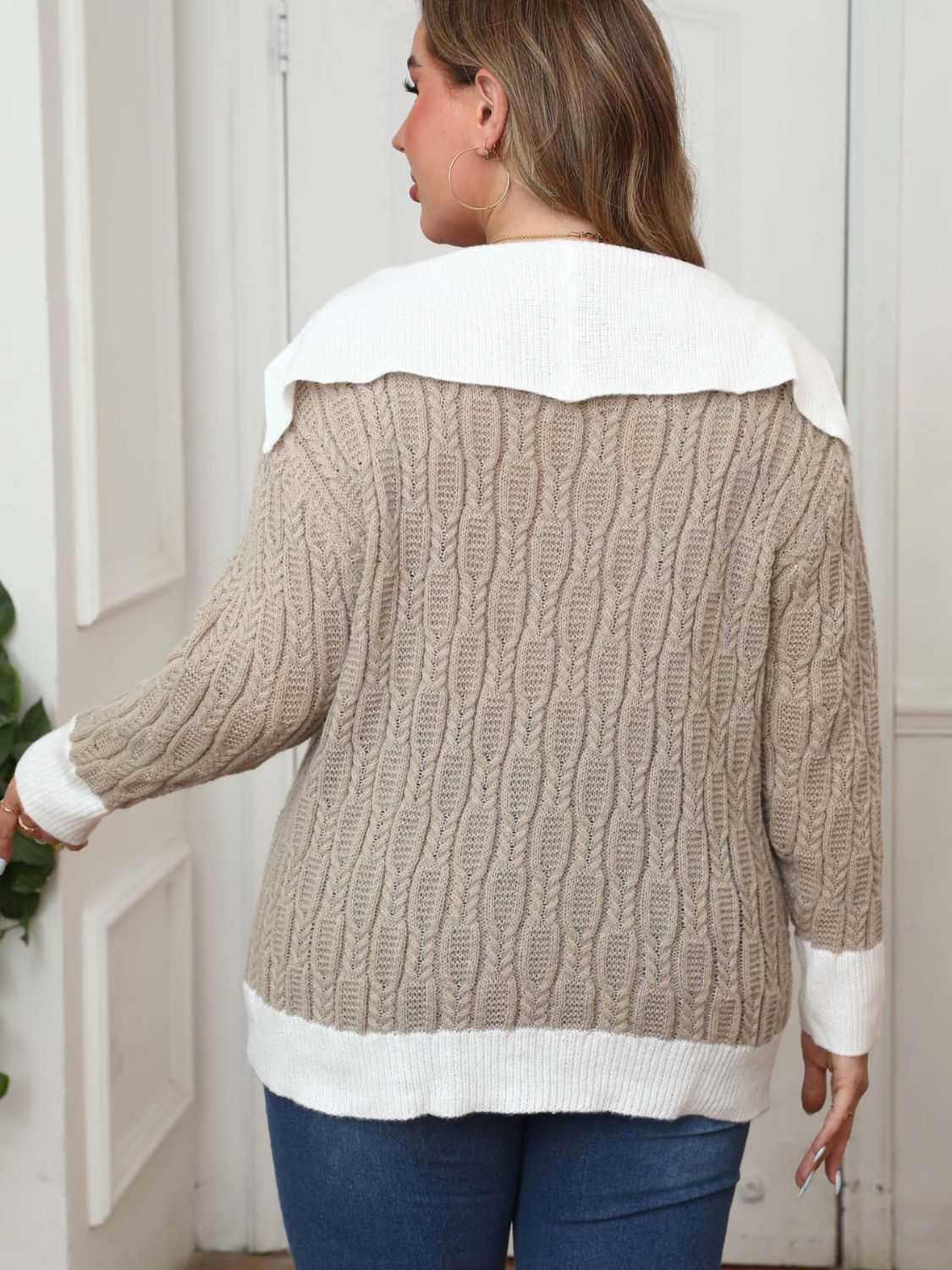 Khaki cable knit sweater with a white contrast collar and cuffs.