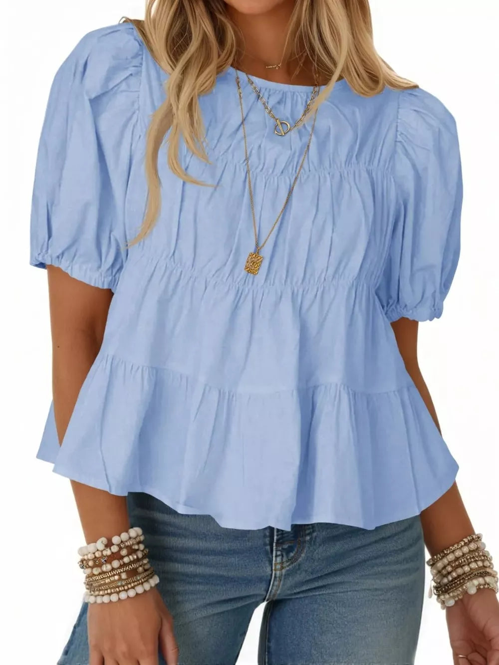 Sky blue maternity blouse with puff sleeves, ruffled tiers, and smocked bodice detail.