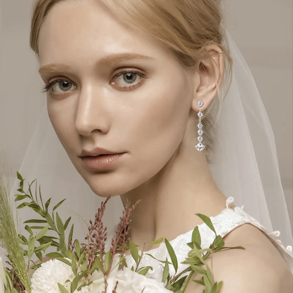 Silver cascading diamond drop earrings with a brilliant sparkle.