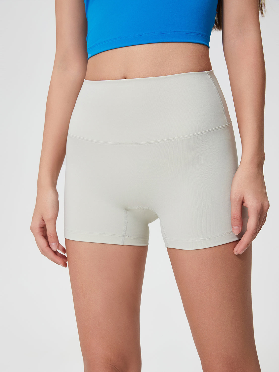 Nova Rise High-Motion Shorts in light gray, with a seamless high waist and short inseam.