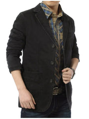 Black cotton blazer with lapel collar, buttoned front, and flap pockets.