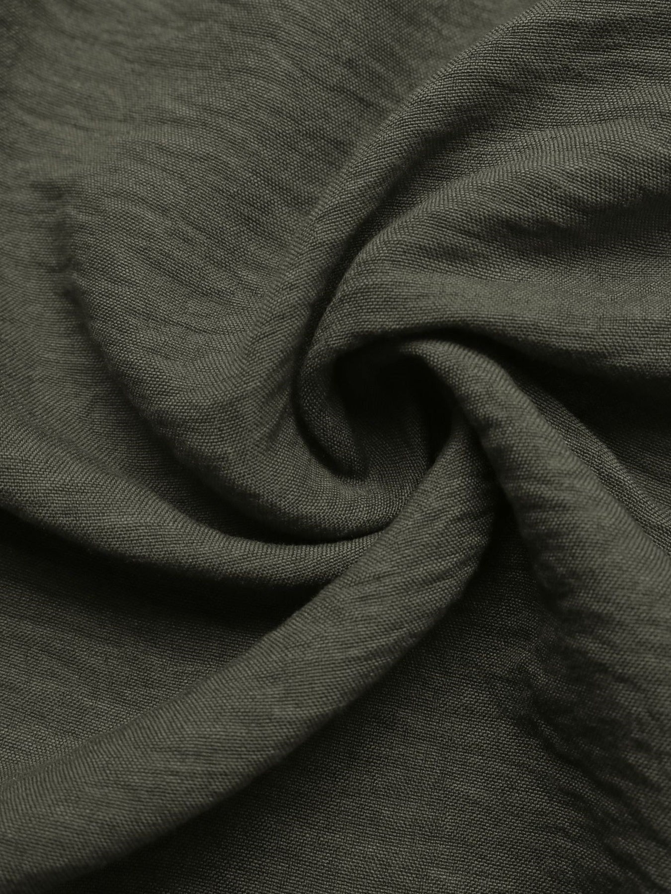 Bohemian maxi dress fabric detail in olive green linen-like material with a textured weave.