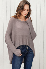 Moss asymmetric slouch knit sweater with long sleeves and a high-low hem.
