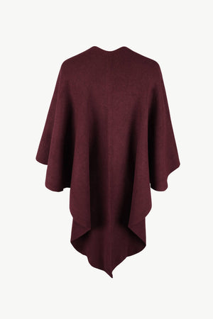 Wine knit cape with draped silhouette and pointed hem