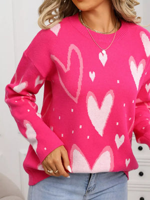 Heartfelt Fuchsia Knit Sweater with allover heart pattern, crew neck, and long sleeves.