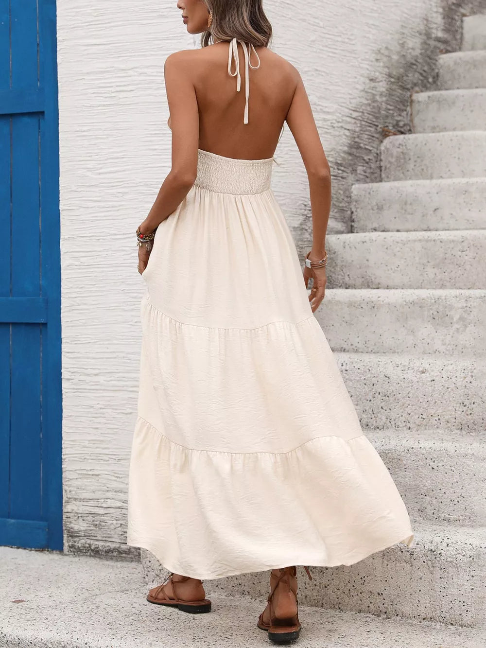 Bohemian halter maxi dress in apricot with tiered skirt and smocked waist.