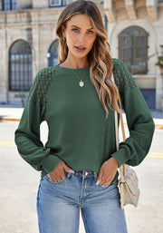 Waffle knit raglan top in Black Forest with lace yoke detail and balloon sleeves.