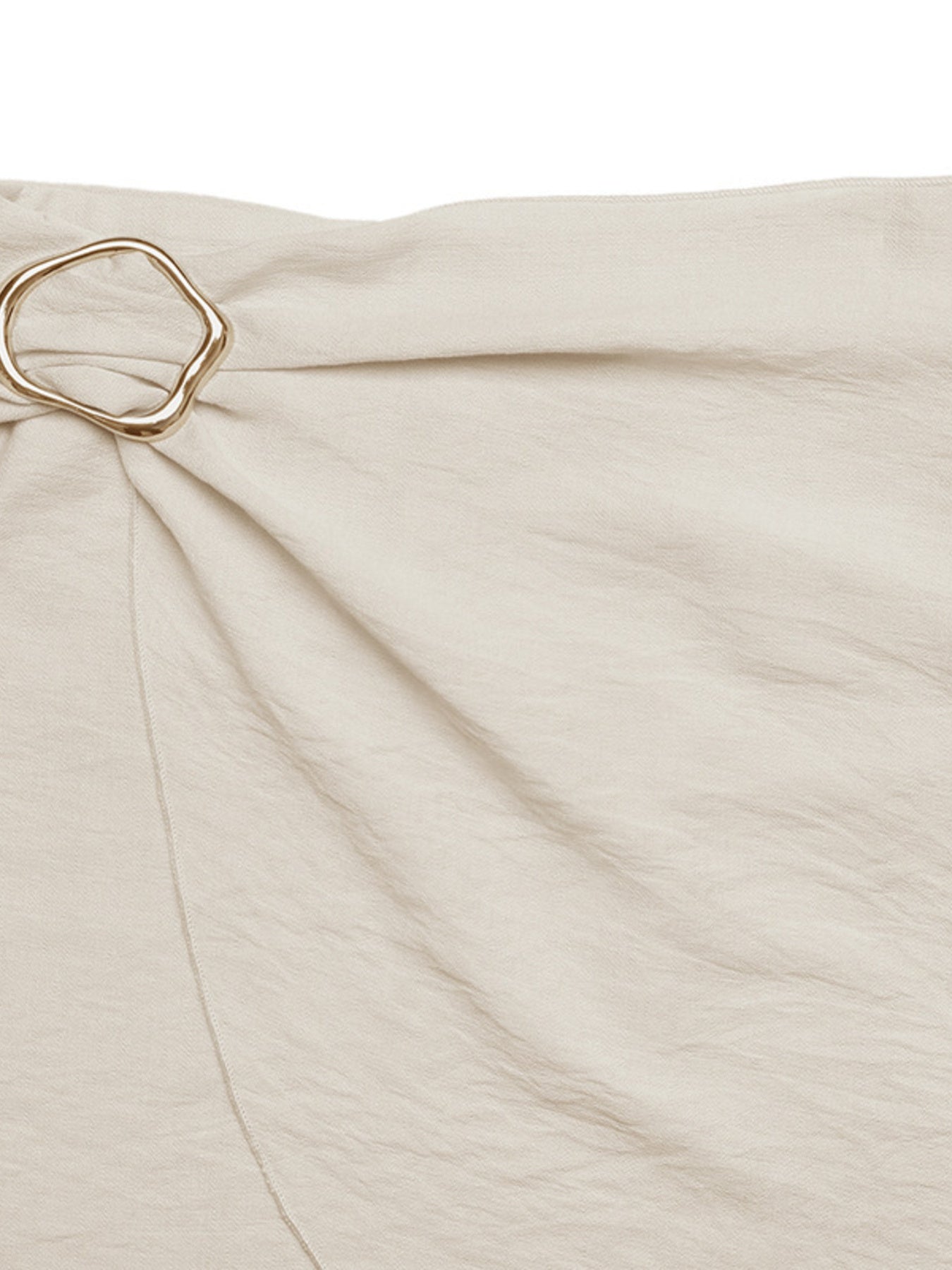 Cream mini skirt with knotted buckle detail and asymmetrical hem