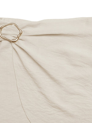 Cream mini skirt with knotted buckle detail and asymmetrical hem