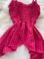 Rose red gingham cami top with smocked bodice and asymmetrical ruffled hem.