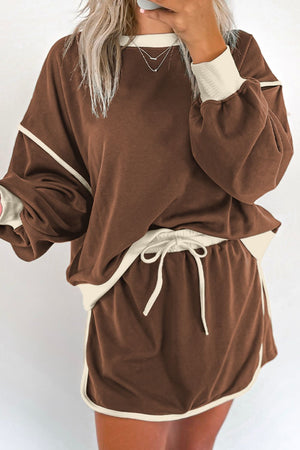 Coffee brown sweatshirt and skort set with cream contrast trim and drawstring waist.
