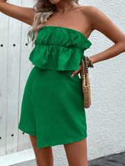 Dark green textured bandeau romper with ruffled bust and wrap skirt detail.