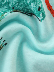 Light blue cotton toddler t-shirt with a green dinosaur graphic and red accents.