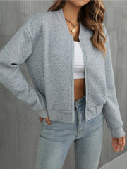 Gray diamond quilted bomber jacket with zip front and ribbed cuffs and hem