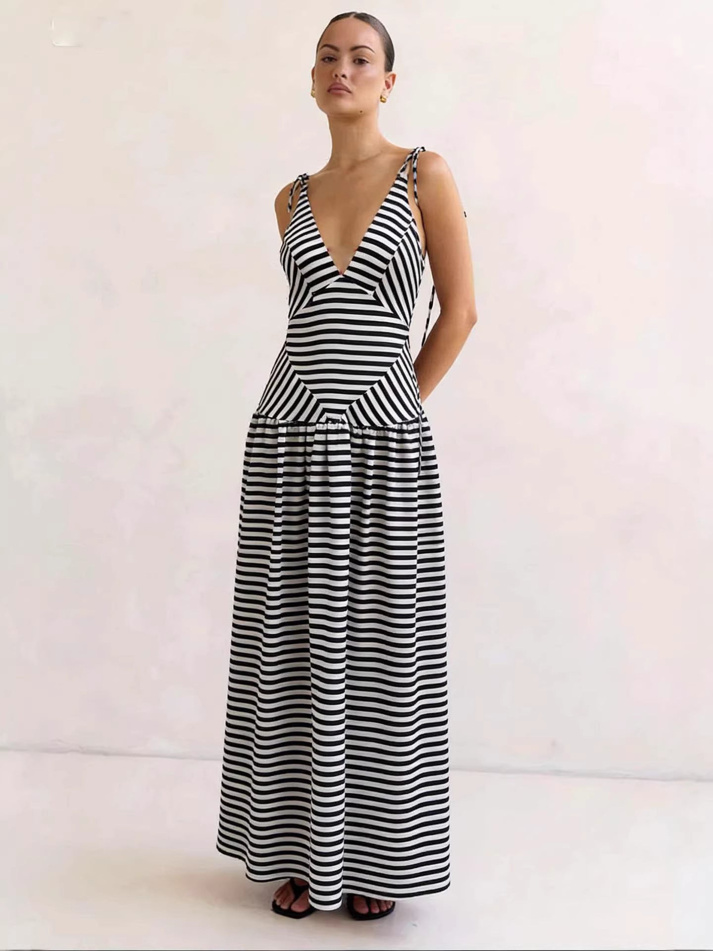 Chevron striped maxi dress with V-neck and tie straps in black and white.