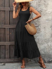 Black smocked bodice tiered maxi dress with scoop neck and sleeveless design