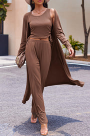 Brown ribbed knit duster, tank top, and wide-leg pants set with side ties.