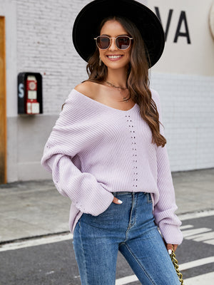Lilac ribbed knit sweater with v-neck and subtle eyelet detail, long sleeves.