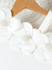 White cotton tank top with floral applique and pearl details.