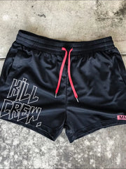 Black mesh athletic shorts with white Kill Crew graphic and neon pink drawstrings.