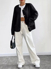 Black textured button-up fleece jacket with pearl buttons and round neckline