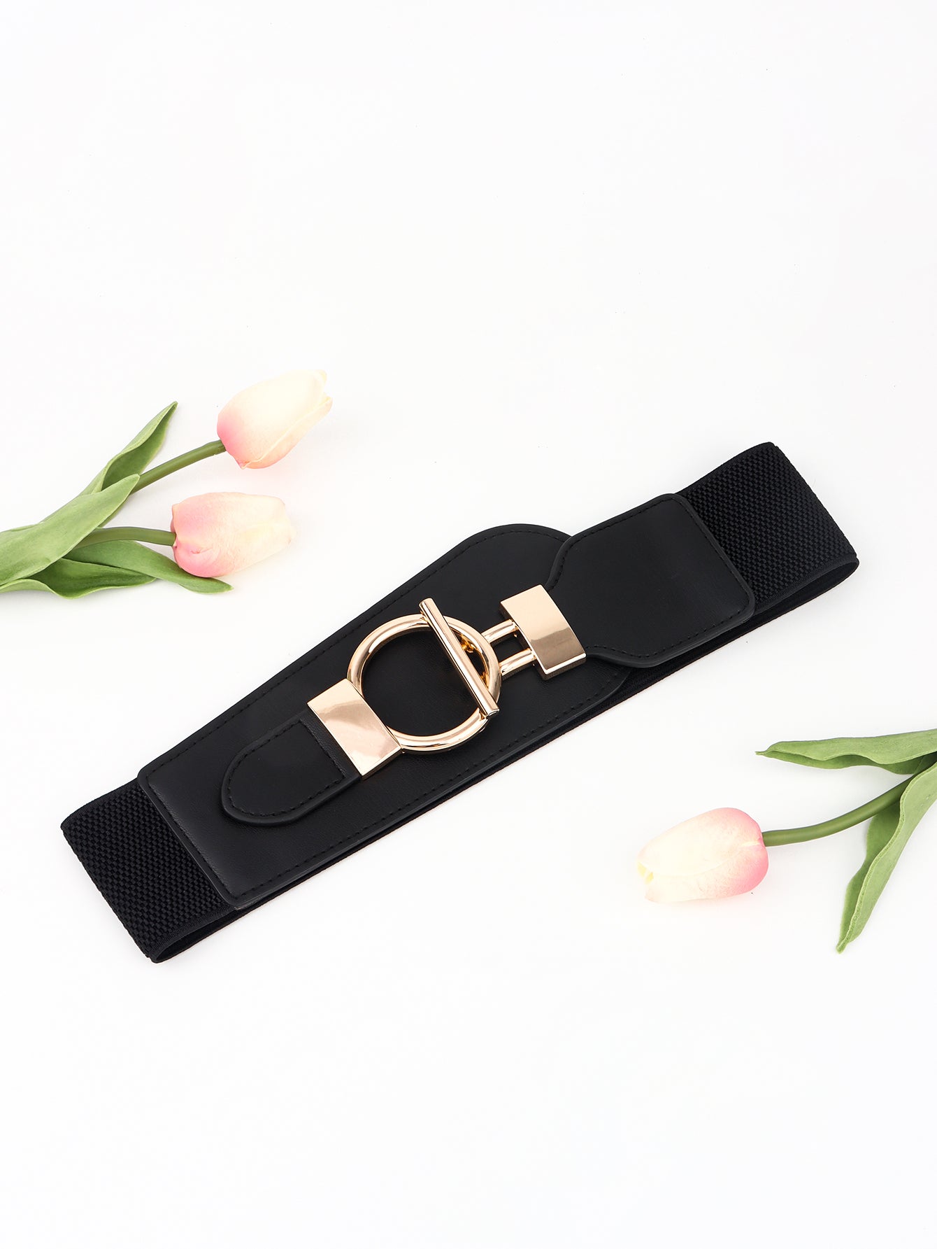 Black elastic belt with gold D-ring buckle and hardware detail