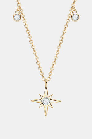 Gold celestial compass pendant necklace with moissanite and dainty chain.