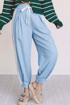 Light blue maternity pants with lace trim and drawstring waist