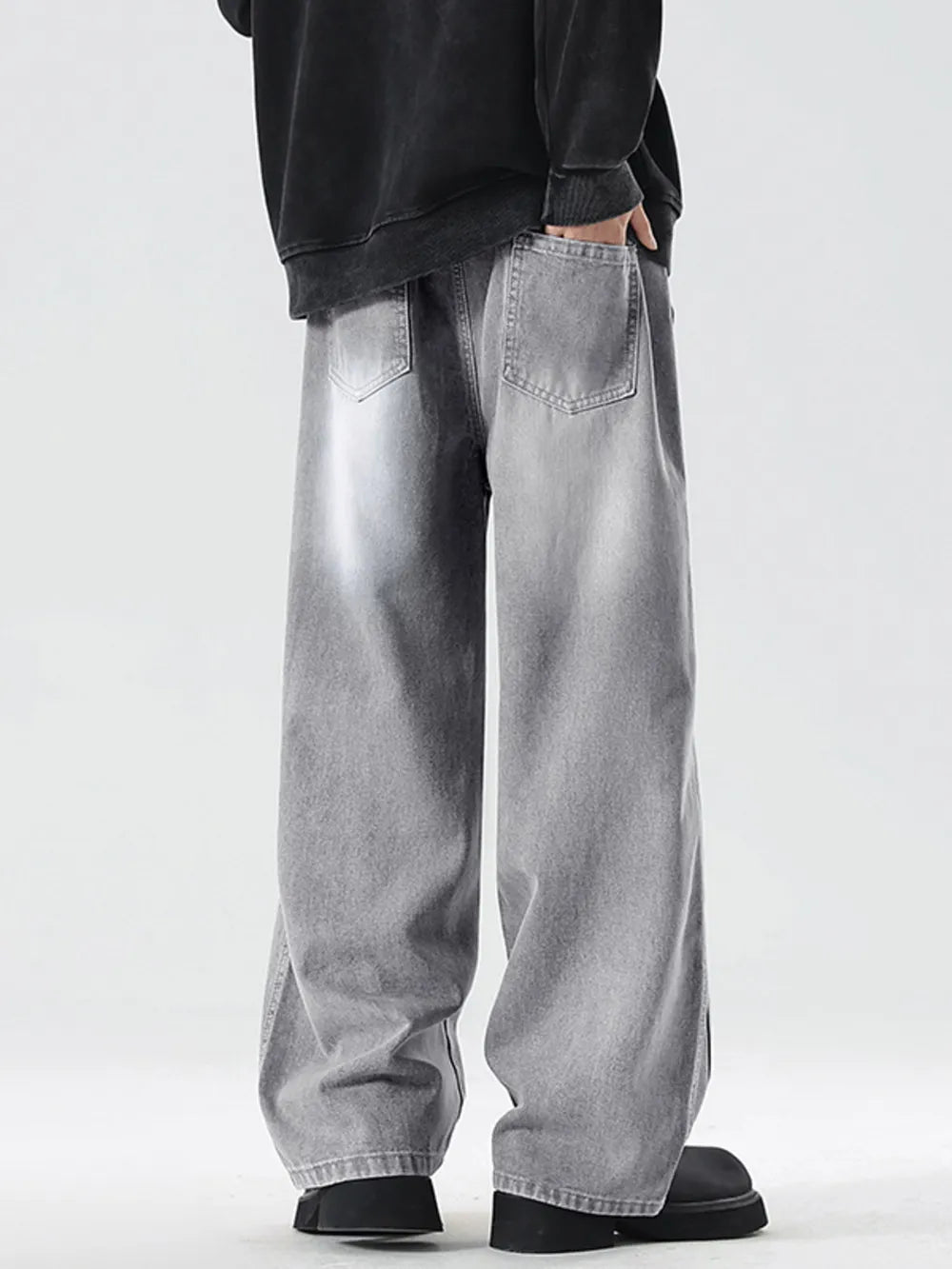 Oversized drawstring washed denim jeans in cement gray with a relaxed fit.