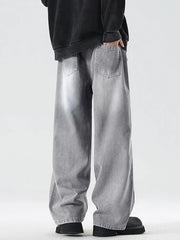 Oversized drawstring washed denim jeans in cement gray with a relaxed fit.