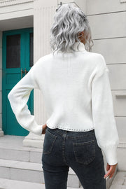 White ribbed turtleneck sweater with scalloped hem detail