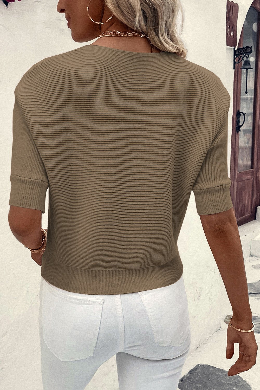 Off-the-shoulder ribbed knit top in olive with short sleeves and a casual fit.