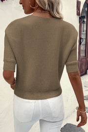 Off-the-shoulder ribbed knit top in olive with short sleeves and a casual fit.