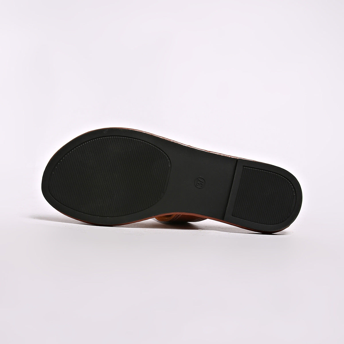Brown PU leather slide sandals with buckled detail, sole view