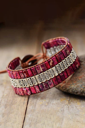 Hot Pink beaded bracelet with floral metal accents and leather cord