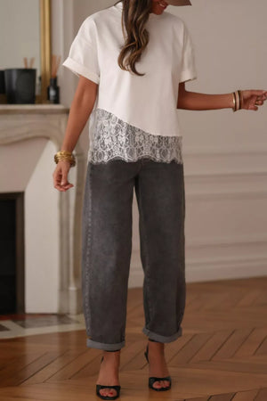 White cotton tee with asymmetrical lace trim detail and cuffed sleeves.