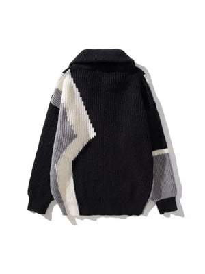 Plus-size black zip collar sweater with color block pattern in white and grey.