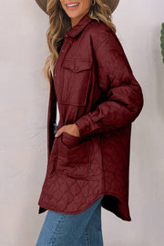 Burgundy quilted utility jacket with chest pockets and button cuffs.