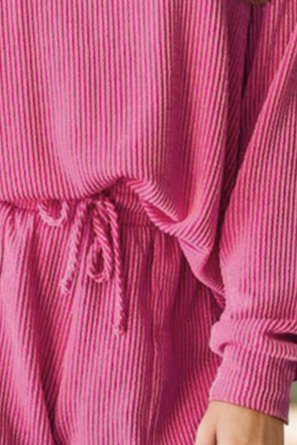 Fuchsia pink ribbed lounge set with drawstring waist and long sleeves.