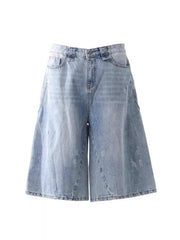 Light wash denim relaxed fit wide-leg capris for men with cargo pockets.