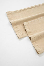 High-waisted cropped wide-leg jeans in beige denim with visible stitching detail.
