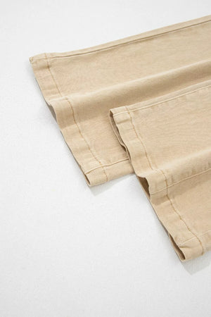 High-waisted cropped wide-leg jeans in beige denim with visible stitching detail.