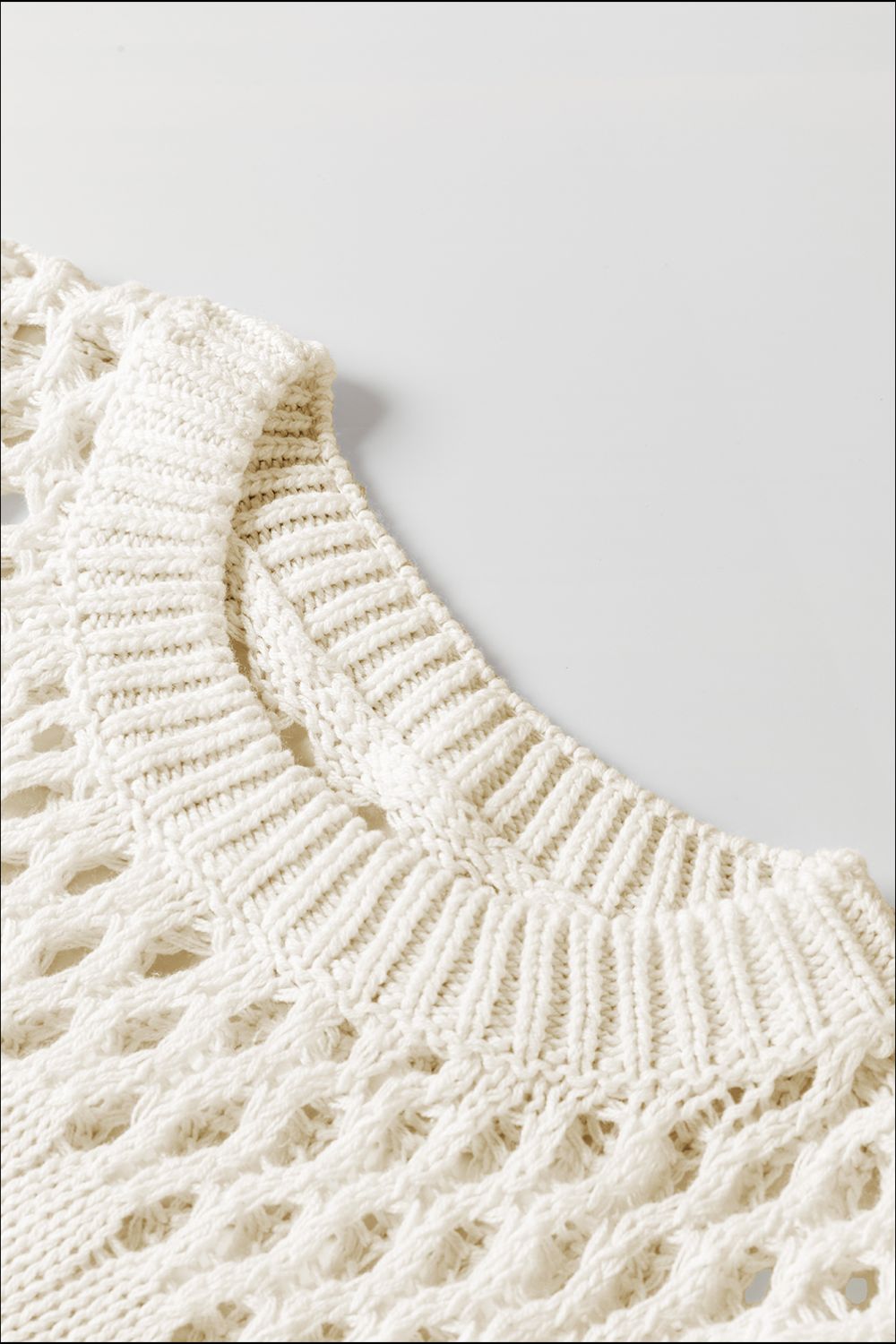 Ivory openwork knit sweater with crew neck and textured details