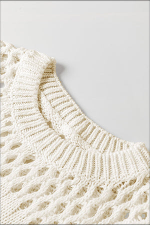 Ivory openwork knit sweater with crew neck and textured details