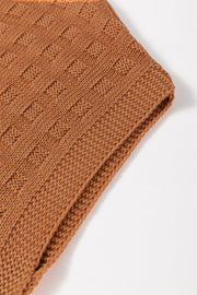 Textured knit boxy top in camel acrylic with a subtle geometric pattern.
