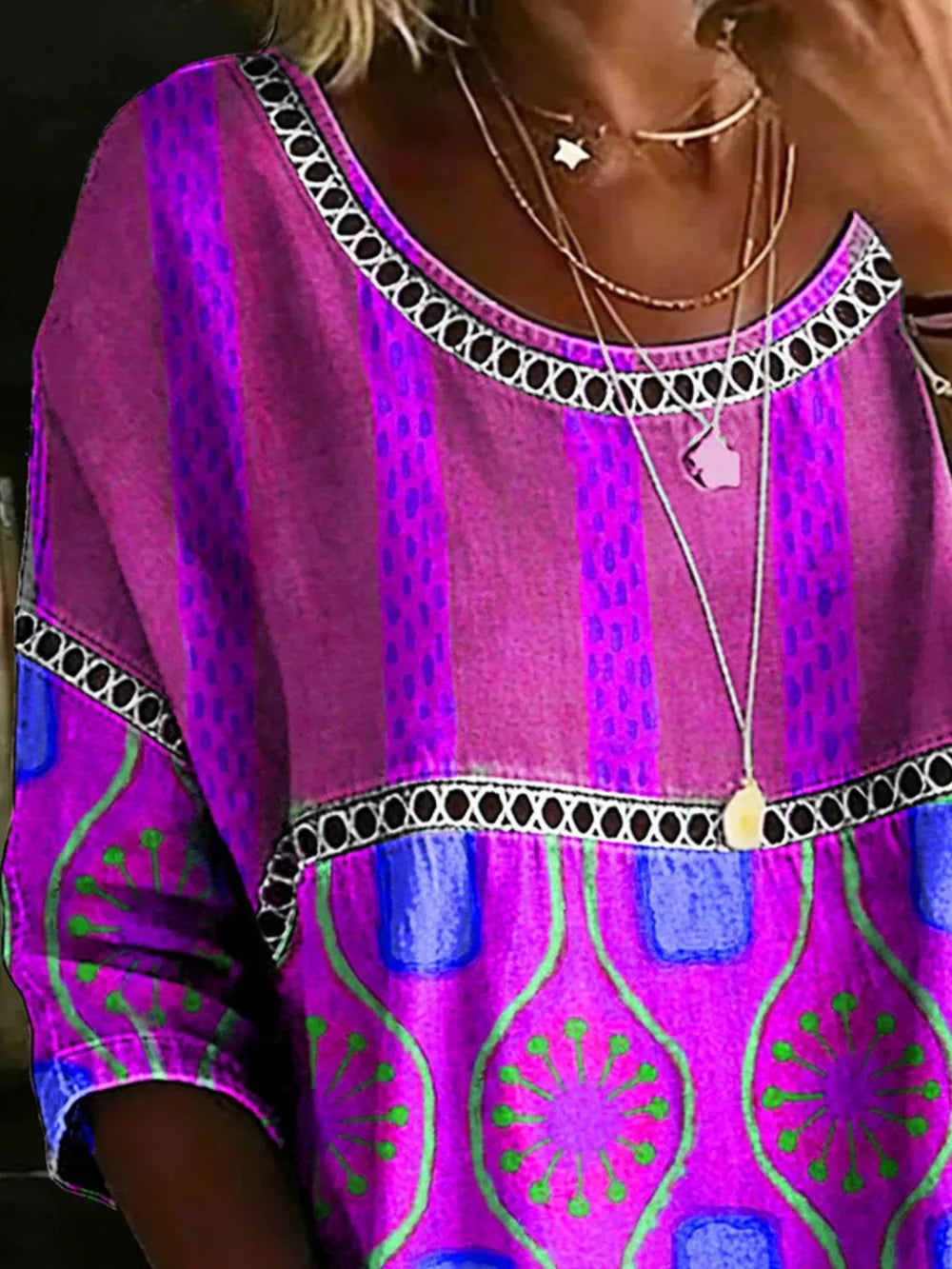 Bohemian maternity t-shirt in purple with floral and stripe print, scoop neck.