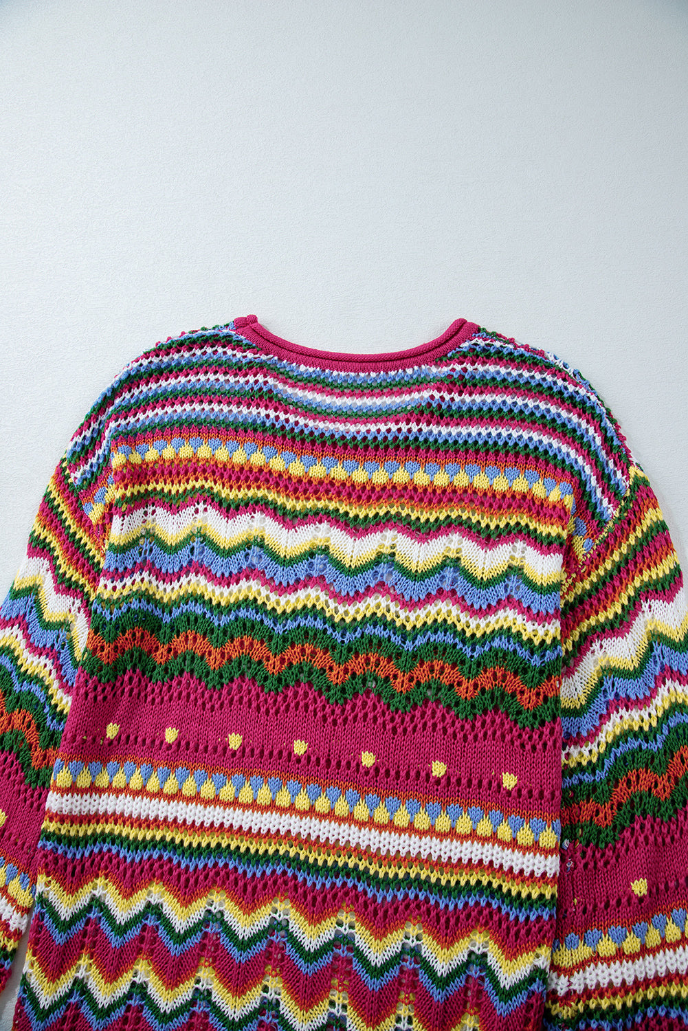Multicolor crochet knit sweater with chevron stripes and open knit details.