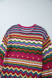 Multicolor crochet knit sweater with chevron stripes and open knit details.