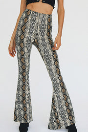 Serpentine print bell-bottom pants with a second-skin fit.